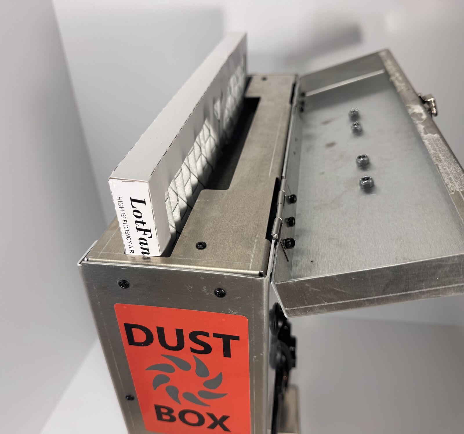 Loading a standard furnace filter into the Dust Box